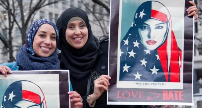 Protestors holding signs.